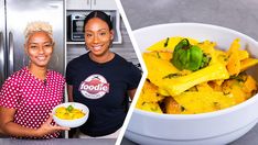 two women standing next to each other in front of a white bowl filled with food