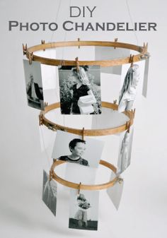 several pictures hanging from a wooden frame with clothes pins attached to them and photos on the strings