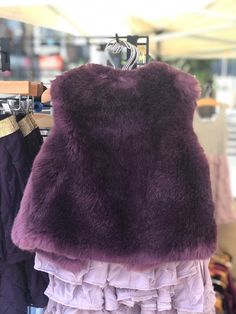 Softest Faux Fur Vest! All of the faux furs that we choose are of high quality, soft to the touch, and won't shed. Looks great paired with leggings, jeans, dress or skirt! - Lined with a purple satin - One hook and eye closure - Dry cleaning recommended Love this fur- probably the softest one yet As with all my items, this vest is handmade with careful attention to detail. I also take the time to brush all the hairs away from each seam that I sew, so that they don't get trapped in the seam and a Purple Faux Fur Outerwear For Fall, Purple Faux Fur Outerwear For Winter, Purple Faux Fur Coat For Winter, Baby Fur Vest, Winter Purple Faux Fur Coat, Winter Faux Fur Vest With Fur Trim, Purple Faux Fur Vest, Girls Vest, Faux Fur Vests