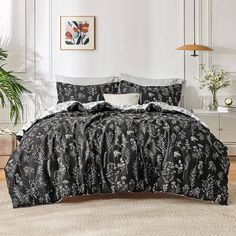 a black and white comforter set in a bedroom