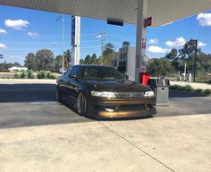 a car is parked at a gas station