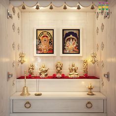 there are two paintings on the wall and some candles in front of them with buddhas