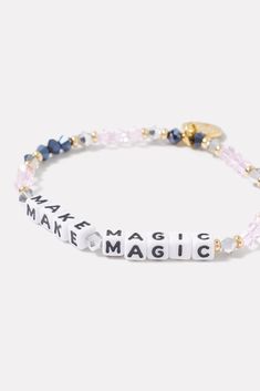 A wearable reminder of words to live by, this beaded bracelet by Little Words Project is handcrafted with "Make Magic" lettering and pink and blue beads. Alone or stacked, it makes the perfect gift for yourself or a friend. Little Words Project encourages you to wear your word to lift you up, and then pass it on to someone who needs it more. Each bracelet comes with a unique ID tag. Use this code to register your bracelet on the Little Words Project website to join the community and track your b Pink Crystal Bracelet With Letter Beads And Round Beads, Pink Crystal Bracelet With Letter Beads, Adjustable Crystal Bracelet With Letter Beads For Everyday, Personalized Pink Beaded Bracelet With Meaningful Style, Personalized Pink Beaded Bracelets, Inspirational Pink Stretch Bracelet With Letter Beads, Inspirational Pink Letter Beads Stretch Bracelet, Everyday Inspirational Pink Bracelets, Adjustable Pink Jewelry With Letter Print