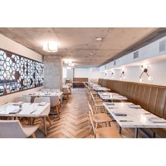 an empty restaurant with tables and chairs