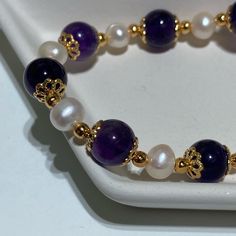 Amethyst And Pearl Bracelet Beads Are 8.5mm Elegant Amethyst Crystal Bracelet With 8mm Beads, Elegant Purple Pearl Bracelet With Round Beads, Elegant Purple Crystal Bracelet With Spacer Beads, White Amethyst Jewelry With 8mm Beads, Elegant Purple Bracelets With 8mm Beads, White Amethyst Beaded Bracelets, Elegant Hand-strung Amethyst Beaded Bracelets, Elegant Purple Hand-strung Bracelets, White Amethyst Round Bead Bracelets