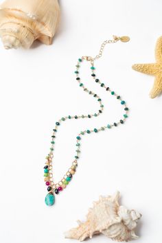 Experience the breathtaking beauty of Cabo with our new and vibrant collection. Make a statement with our shorter necklace, showcasing a stunning turquoise focal. Gold Filled (nickel and lead-safe) Turquoise, Pearl, Ruby Jade, Lime Magnesite 15.5-17.5", adjustable with gold filled lobster claw clasp We hand select our natural materials, thus there may be slight variations in color and/or size that will not detract from the overall aesthetic Our unique handcrafted designer jewelry for women is ma Turquoise Amazonite Necklace With Natural Stones, Artisan Turquoise Necklace With Gemstone Accents, Artisan Turquoise Necklaces With Gemstone Accents, Multicolor Chrysocolla Necklace For Jewelry Making, Turquoise Bohemian Necklace With Gemstone Accents, Bohemian Turquoise Necklace With Gemstone Accents, Bohemian Multicolor Beaded Necklaces With Gemstone Accents, Bohemian Turquoise Amazonite Necklace, Bohemian Turquoise Stone Necklace