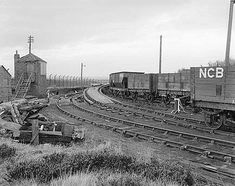 black and white photograph of an old train yard