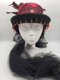 Black velvet top hat with red ribbon trim, black lace, feathers and veil. One size. SHOP POLICIES: Orders placed Monday-Friday generally ship next day. Orders placed Saturday/Sunday ship the following Tuesday. Cancellations are permitted before an item ships. Please note that we do not accept returns. Gothic Costume Hats And Headpieces For Carnival, Gothic Costume Hats And Headpieces For Cosplay, High Crown Costume Accessories For Halloween Party, High Crown Halloween Costume Accessories For Costume Party, Black Top Hat For Costume, Black Steampunk Top Hat For Alternative Fashion, Gothic Fitted High Crown Costume Accessories, Black Fitted Top Hat For Costume, Gothic High Crown Costume Accessories For Costume Party