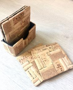 two pieces of cork sitting on top of a white table next to an open box