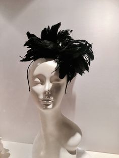 "Black Bird fascinator- Halloween- Feather Headband- Kentucky Derby- Ravens- Crow- Horse race- Mad Hatter Hello, I have one made so it can ship within a day or two. This fascinator is perfect to add whimsy and is just so fun you'll be the life of the party. A great conversation piece Most people while talking to you don't notice the bird at first and then all of a sudden they say,\" oh my God you have a bird on your head !\" This black feather fascinator has a black feather bird with a puff of b Bird Fascinator, Bird Hat, Feather Bird, Black Fascinator, Feather Fascinator, Horse Race, Feather Fascinators, Feather Headband, Life Of The Party