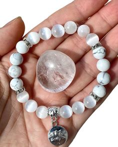 "🕊8mm Selenite with Howlite Bracelet🕊 🤍Includes ONE bracelet with ONE Clear Quartz Tumble🤍 📏 Sizes: Small: 6\", Medium: 7\", Large: 8\"  ✨Selenite has a high vibration, and its primary gifts are cleansing, clearing, and the release of stagnation. It is one of the few crystals that is genuinely self-cleansing, and it is frequently used to cleanse and charge other crystals, as well as areas✨ ✨ Howlite comes with a whole host of healing benefits that soothes the body, mind, and spirit. Above e White Crystal Bracelet With Gemstone Beads As Gift, White Crystal Bracelet With 8mm Beads, White Moonstone Bracelets For Healing, White Crystal Bracelet With Round Beads For Meditation, White Moonstone Beaded Bracelets With Natural Stones, White Moonstone Beaded Bracelet With 8mm Beads, White Crystal Bracelet With Natural Stones For Gift, White Crystal Bracelet With Natural Stones As Gift, White Crystal Bracelet With Round Natural Stones