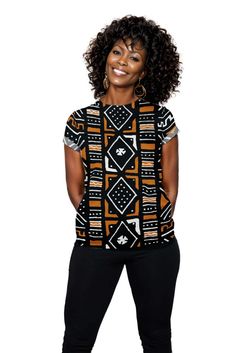 This Women T-shirt features a unique African Mudcloth Print that adds a touch of cultural charm to your wardrobe. Made with high quality material, it offers comfort and style. Perfect for cultural events or everyday wear. Product Features Please Compare your Measurements To our Size Chart This T-shirt is Designed for fashionable women. Made from 5.47 Oz. 100% polyester. Double-needle hemmed sleeves and bottom. Vivid print that will never fade after washing Soft, lightweight and quick drying. Del Relaxed Fit Tops With Unique Print And Short Sleeves, Casual Short Sleeve T-shirt With Unique Print, Crew Neck Cotton Top With Unique Print, Cotton Crew Neck Top With Unique Print, Traditional Black Crew Neck Top, Traditional Printed Black Tops, Black Cotton Blouse With Graphic Print, Traditional Black Printed Top, Traditional Cotton Crew Neck Top