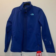 Jacket Has Never Been Worn And Is In Brand New Condition. Features A Variety Of Pockets On The Arm And Sides. Windwall Technology To Have Even More Rain/Wind Resistance. Spring Blue The North Face Outerwear, Blue The North Face Outerwear For Spring, The North Face Purple Long Sleeve Outerwear, The North Face Purple Outerwear For Fall, Functional Blue Outerwear For Work, Blue Functional Outerwear For Work, Brown North Face Jacket, Black North Face Coat, Green Parka Coat