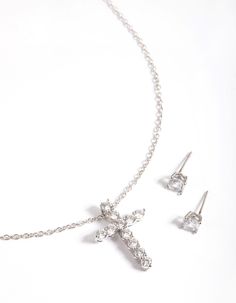 Treat yourself, or your loved ones, to fine jewellery pieces crafted with diamond simulants. These dazzling pieces are crafted from gorgeous, lab-created crystals and come wrapped and ready in a Lovisa gift box! | Lovisa Rhodium Diamond Simulant Stud & Cross Necklace Set Crystal Jewelry Sets With Diamond Accents For Gift, Silver Diamond Cut Jewelry Sets Gift, Diamond White Jewelry Sets With Diamond Accents For Gift, Silver Jewelry Sets With Diamond Accents For Gift, Silver Crystal Jewelry Set As Gift, Silver Crystal Jewelry Set For Gift, Diamond White Jewelry Set With Sparkling Stones For Gift, White Jewelry Sets With Sparkling Stones For Gift, Diamond White Jewelry Set With Rhinestones For Gift