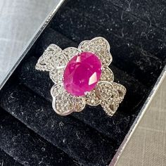 This Beautiful Ring Features A Stunning Burmese Ruby At The Center. Oval Cut, It Has Fancy Decorative Work Around It, Filled With Clear Stones. They Tested As Diamonds, But May Be Zircons. The Ring Is Stamped "Y" Inside A Circle And Also "925 China". I Have Not Been Able To Identify This Maker. Made Of Sterling Silver, It May Also Be Plated With Rhodium To Keep It Looking It's Best. The Stunning Ruby Measures About 5mm By 8mm In Size. The Ring Is A Size 6, And Is In Nearly Perfect Condition. From A High End Estate. Burmese Ruby, Art Deco Wedding Band, Gold Heart Ring, Gold Statement Ring, Gold Ring Sets, Engagement Ring Sizes, Rhinestone Ring, Cut It, Silver Rhinestone