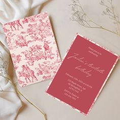 the wedding stationery is pink and red