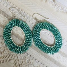 Simply beautiful beaded dangle earrings made with gorgeous light emerald 11.0 seed beads. The french hook earwires are sterling silver. These very lightweight earrings are handmade with each tiny bead individually woven. They measure 2 inches total including the earwires. The hoops are 1.5 inches. Great for daywear and stunningly chic for all occasions. Click below to see more beautiful items from Work of Heart Shop Home https://www.etsy.com/shop/workofheart Thanks for shopping at Work of Heart Elegant Teardrop Earrings With Tiny Beads, Silver Teardrop Beaded Earrings, Green Teardrop Earrings With Tiny Beads, Elegant Beaded Earrings With Oval Beads, Elegant Oval Beaded Earrings As Gift, Elegant Oval Beaded Earrings For Gift, Elegant Oval Beaded Earrings, Handmade Oval Beaded Earrings As Gift, Handmade Oval Beaded Earrings For Gift