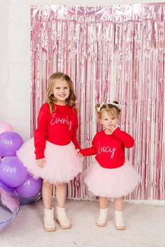 Our Custom Name Sweatshirt is a perfect custom gift for someone special! Add one of our popular tutus to complete the outfit!  This full tutu has ten layers with a wide elastic band inside to keep the itchy tulle off your little ones' skin. The multiple soft layers give a fluffy look but lay perfectly.  OPTIONS AVAILABLE FOR PURCHASE:  Red Sweatshirt with Pink print or White Sweatshirt with Black Print (Custom print colors are available. Please message before purchase to confirm color option) Tu Cute Customizable Long Sleeve T-shirt, Customizable Pink Long Sleeve T-shirt, Customizable Long Sleeve Pink T-shirt, Pink Long Sleeve Customizable T-shirt, Custom Name Crew Neck T-shirt For Birthday, Birthday Long Sleeve T-shirt With Name Print, Customizable Red Tops For Birthday, Custom Name T-shirt For Birthday With Crew Neck, Family Matching Long Sleeve Birthday T-shirt