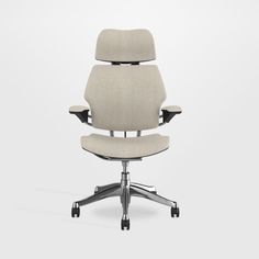 an office chair with wheels on the back and seat upholstered in beige fabric