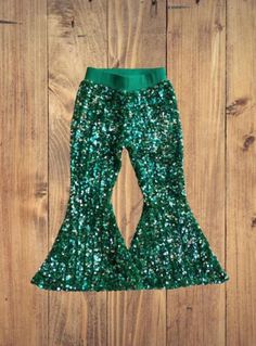 Includes: Bell Bottoms Only Care instructions: Turn inside out. Machine was cold and tumble dry low Stretch Green Pants For Winter, Green Stretch Pants For Winter, Casual Green Bottoms For Winter Party, Green Sequined Bottoms For Spring, Spring Green Sequined Bottoms, Green Sequin Party Pants, Green Sequined Party Pants, Green Sequined Stretch Bottoms, Green Stretch Sequined Bottoms