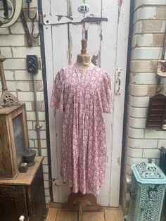 Vintage Laura Ashley pink white patterned tunic dress size M UK 12. 100% Cotton. Original 1970's label "Laura Ashley, Made in Wales". Made at the factory in Carno, mid Wales. No size on label but fits me and I am UK 10/12 - please check measurements to be sure it will fit you. Short sleeves, pleat detail at front and back, has been cut down to make a shorter dress - would originally have been longer. Size:  Chest: 36 inches; Length: 39.5 inches. Weight: allow up to 1 kg once packed. Good vintage Pink Printed Midi Dress For Daywear, Spring Pink Printed Tunic, Pink Printed Tunic Dress, Pink Printed Daywear Dresses, Pink Printed Dresses For Daywear, Vintage Pink Printed Dresses, Pink Tunic Dress For Daywear, Mid Wales, Vintage Laura Ashley