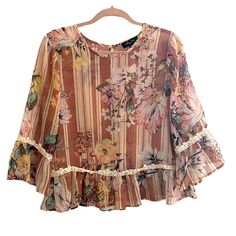 New Without Tags! Never Worn. In Great Condition. No Flaws! Features Crotchet Design At Bell Sleeves And Hem. Stripe And Floral Design In Beautiful Earth Tone Colors. 100% Polyester. Pink Floral Print Chiffon Tops, Spring Bohemian Chiffon Tops, Spring Bohemian Chiffon Blouse, Casual Pink Chiffon Blouse, Summer Chiffon Tops With Lace Trim, Spring Chiffon Tops With Lace Trim, Chiffon Tops With Lace Trim For Spring, Bohemian Chiffon Blouse With Floral Print, Pink Chiffon Tops For Beach