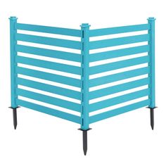 a blue metal fence with spikes on each side