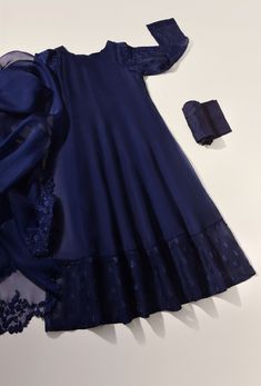 A luxurious pure organza panelled kalidaar in an alluring navy blue tone with intricate embroidery details alongside sheer embroidered sleeves. It is paired with a floral cut work pure organza dupatta and matching pencil trousers for a show stopping look. Order Duration: 4 to 6 weeks Navy Blue Combination Dress, Navy Blue Kurti Design, Blue Organza Anarkali Set With Intricate Embroidery, Blue Semi-stitched Anarkali Set For Formal Occasions, Elegant Blue Churidar With Intricate Embroidery, Formal Blue Semi-stitched Anarkali Set, Unstitched Blue Anarkali Set For Formal Occasions, Formal Blue Anarkali Set With Resham Embroidery, Formal Blue Unstitched Suit With Sheer Dupatta