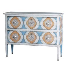 a blue and yellow painted chest with flowers on the front, two drawers at the bottom