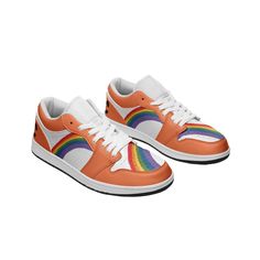 an orange and white shoe with rainbows on the side, in front of a white background