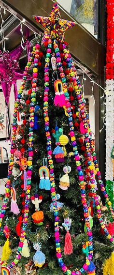 a brightly colored christmas tree in a store