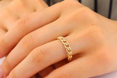 Introducing our exquisite 14K Solid Gold Chain Ring, a true reflection of elegance and timeless beauty. Crafted with precision and care, this ring is made from 14K solid gold, ensuring durability and a stunning shine that will last a lifetime. The delicate chain design adds a touch of sophistication, making it a perfect accessory for any occasion. Each link is meticulously connected, creating a seamless and comfortable fit. This ring is a testament to the craftsmanship and attention to detail th Elegant Tarnish Resistant Link Chain Ring, Elegant Tarnish-resistant Link Chain Ring, Elegant 14k Gold Rings With Chain Detail, Modern Gold Plated Chain Ring As Gift, Modern Gold Plated Chain Ring For Gift, Elegant Gold Plated Open Chain Ring, Minimalist Gold Chain Jewelry For Anniversary, Timeless Gold Plated Stackable Wedding Rings, Timeless Chain Ring As Gift