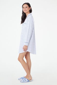 You sleep better in cute pajamas — it's science. The Perlita Lounge Dress is a super soft cotton nightshirt with a button front and front pocket. The blue hearts print adds a fanciful touch to a classic sleep style. 6 Buttons Front Patch Pocket Materials and Care 100% Long-Staple Premium Cotton Machine Wash Cold, With Like Colors Do Not Bleach, Tumble Dry Low (Line Dry Recommended) Imported Measurement Information Model Wears Size Small Size S Length: 34.5" (from Shoulder) Size S Sleeve Length: The Blue Hearts, Sleepover Bag, Womens Dress Tops, Hearts Print, Fall Lookbook, Blue Hearts, Roller Rabbit, Casual Tunics, Baby Pajamas