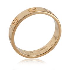 Cartier Love Band in 18k Yellow Gold   PRIMARY DETAILS   SKU: 140023   Listing Title: Cartier Love Band in 18k Yellow Gold   Condition Description: Cartier's Love collection is the epitome of iconic, from the recognizable designs to the history behind the line-up. The collection started in 1969 with the bangle bracelet, which is engraved with a circular motif throughout to mimic the look of the bracelet's signature screw-lock mechanism.       Retails for 1250 USD. In excellent condition and recently polished. Ring size is 49.   Brand: Cartier   Collection/Series: Love   Metal Type: Yellow Gold   Metal Purity: 18k   Ring Size: 49   Pre-Owned Jewelry Condition: Excellent   SIDE STONE INFORMATION   Original Box?: No   Original Papers?: No   This item has been used and may have some minor flaw Classic Gold-tone Logo Plaque Jewelry For Formal Occasions, Classic Formal Jewelry With Gold-tone Logo Plaque, Classic Formal Jewelry With Gold-tone Logo, Timeless Yellow Gold Jewelry With Gold-tone Logo, Timeless Yellow Gold Jewelry With Logo Plaque, Timeless Yellow Gold Jewelry, Gold-tone Logo Plaque Jewelry For Anniversary, Gold Jewelry With Gold-tone Logo Plaque For Anniversary, Luxury Gold-tone Jewelry For Anniversary