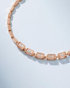 Crafted with solid 18-karat gold, this block-chain bracelet presents a symphony of four-sided links. It features five links set with baguette white diamonds on all four sides. The medium, block-chains add a contemporary edge to the timeless design making it perfect for casual or evening wear. Details 18k yellow gold, rose gold or white gold 2.05 carats of baguette white diamonds Measures 7" inches in length, adjustable at 6.5" inches Model styling 7" bracelet in yellow gold, first from the right Luxury Chain Bracelet With Rectangular Cubic Zirconia Links, Luxury Chain Bracelet With Cubic Zirconia, Elegant Gold Diamond Bracelet With Emerald Cut, Luxury Gold Diamond Bracelet With Emerald Cut, Formal Rose Gold Baguette Cut Bracelet, Formal Rose Gold Baguette Jewelry, Modern Baguette Diamond Bracelet For Formal Occasions, Modern Baguette Diamond Cut Jewelry, Elegant Rose Gold Jewelry With Rectangular Links