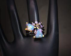 Luxury Open Opal Ring For Gift, Luxury Open Opal Ring Gift, Luxury Opal Ring With Accent Stones For Gift, Fusion Style Opal Jewelry For Gifts, Fusion Style Opal Jewelry Gift, Cluster Jewelry With Accent Stones For Gifts, Exquisite Cluster Rings For Gift, Exquisite Cluster Jewelry Gift, Purple Multi-stone Gemstones For Gift