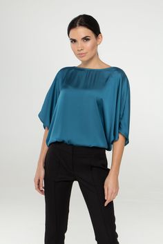 "A soft satin blouse featuring a boat neckline, half dolman sleeves, loose silhouette, and a relaxed fit. - kimono style blouse - loose silhouette - boat neck - half sleeves - Color: blue Fiber: 30% viscose, 70 % polyester. You may feel free choosing the size. Just send us your measurements (bust, waist, hips, height). We will define your correct size. SIZE CHART XS __ EU 34 __ US 4 bust: 31,5\" | 80 cm waist: 24,5\" | 62 cm hips: 34,5\" | 88 cm S __ EU 36 __ US 6 bust: 33,0\" | 84 cm waist: 26, Summer Boat Neck Blouse, Chic Blouse With Kimono Sleeves For Work, Chic Blue Satin Top, Elegant Spring Tops With Kimono Sleeves, Chic Workwear Blouse With Kimono Sleeves, Spring Batwing Sleeve Blouse, Chic Blue Satin Blouse, Elegant Batwing Sleeve Tops For Spring, Chic Kimono Sleeve Tops For Work