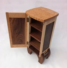 an open wooden cabinet with shelves on both sides