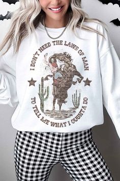 WESTERN COWGIRL DON'T NEED LAWS OVERSIZED GRAPHIC SWEATSHIRTPREMIUM COTTONOVERSIZED FIT Casual Sweater With Graphic Print For Fall, White Graphic Print Sweater For Fall, Casual Winter Sweatshirt With Funny Print, Casual Funny Print Winter Sweatshirt, Oversized Long Sleeve Top With Funny Print, Funny Print Long Sleeve Winter Tops, Winter Long Sleeve Tops With Funny Print, Fall Cotton Sweater With Graphic Print, Fall Long Sleeve Tops With Funny Print