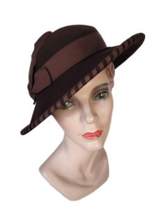 Elegant edged brown felt hat, Made in the U.S.A. by Merrimac. Walk in style with this original.  Condition is very good. Hat can fit many sizes Perfect hat for every occasion.  Wedding, Party, Beach, Picnic, Church, from A to Zone hat, a variety of LOOKS! Add sweet day dress and off to the Gatsby you go. HAT BLOCK/MANNEQUIN NOT INCLUDED Buyer pays all related shipping costs, including insurance. All Sales Final Thank you, CityVintage Vintage Fur Felt Fedora For Fall, Vintage Fedora With Curved Brim For Fall, Classic Brown Felt Hat With Curved Brim, Retro Formal Fedora With Wide Brim, Retro Wide Brim Fedora For Formal Occasions, Retro Fitted Brimmed Felt Hat, Vintage Fitted Fedora For Fall, Vintage Brimmed Fedora For Fall, Retro Adjustable Felt Hat For Formal Occasions