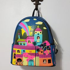 Loungefly Encanto Disney Parks Exclusive Backpack Nwt No Flaws Main Zipper Front Zip Pocket Adjustable Straps Multicolor Backpack For Theme Park, Disney Multicolor Backpack For Theme Park, Multicolor Disney Backpack For Theme Park, Disney Purple Travel Backpack, Fun Multicolor Backpack For Disney Trips, Blue Disney Backpack With Adjustable Strap, Disney Multicolor Bags With Adjustable Strap, Blue Backpack For Theme Park, Disney Multicolor Backpack For Everyday Use