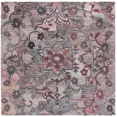 an area rug with many different colors and designs on the carpet, including pinks, blue