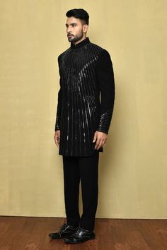 Black sherwani with embellished stripe patterns. - Aza Fashions Designer Ceremonial Kurta With Mirror Work, Designer Ceremonial Sherwani With Mirror Work, Designer Dabka Kurta For Party, Designer Party Kurta With Dabka Detail, Traditional Formal Kurta With Sequins, Traditional Sequined Kurta For Formal Occasions, Designer Formal Bandhgala With Mirror Work, Designer Party Kurta With Mirror Work, Designer Bandhgala With Mirror Work For Formal Occasions