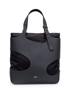 Black tote bag in grained leather. Interior lined with padded technical fabric. Adjustable leather handles. Inside zipper pocket. Logo on front. Width:38 Height:41Depth:13Gender: MenMaterial: OUTSIDE:100% CALFSKIN, 100% FABRICColor: BlackMade in: ITProduct ID: 241311 770070*Import tax/duty will be calculated at checkout (If applicable) Modern Coated Canvas Satchel, Modern Nylon Shoulder Bag With Leather Handles, Modern Nylon Satchel, Nylon Shoulder Bag With Leather Trim And Double Handle, Modern Nylon Shoulder Bag With Top Handle, Double Handle Nylon Shoulder Bag With Leather Trim, Modern Nylon Top Handle Bag, Modern Nylon Bag With Leather Trim, Modern Nylon Shoulder Bag With Double Handle