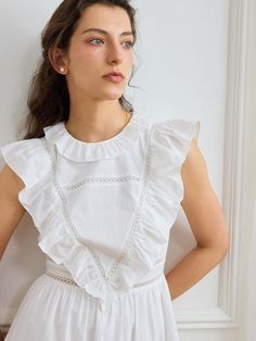 Color: WhiteStyle: CasualPattern Type: PlainDetails: Ruffle, Contrast Lace, Ruffle HemType: A LineNeckline: Round NeckSleeve Length: SleevelessWaist Line: High WaistHem Shaped: FlounceLength: ShortFit Type: Regular FitFabric: Non-StretchMaterial: Woven FabricComposition: 100% CottonCare Instructions: Machine wash or professional dry cleanSheer: Semi-Sheer Feminine Sleeveless Mini Dress With Scalloped Edges, Spring Day Dresses With Scalloped Edges, Spring Daywear Dresses With Scalloped Edges, Chic Cotton Ruffle Dress, Chic Cotton Ruffle Sleeve Dress, Feminine Ruffle Dress With Lace Trim For Spring, Summer Garden Party Dress With Ruffled Collar, White Mini Dress With Scalloped Edges For Summer, White Summer Mini Dress With Scalloped Edges