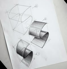 a drawing of three rolls of paper on top of a piece of paper next to each other