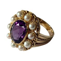 Romantic Vintage Ring in 18 K yellow Gold inspired by the Victorian era featuring an oval cut Amethyst and cultured pearls in a rope textured setting. The ring is currently size 13/53 but can be resized easily. Matching pendant/brooch available! Masterfully handcrafted piece! Authenticity and money back is guaranteed. For any enquires, please contact the seller through the message center. Victorian Luxury Amethyst Wedding Ring, Vintage Amethyst Ring Gold, Victorian Rings Vintage, Most Expensive Jewelry, Message Center, Pendant Brooch, Victorian Rings, Expensive Jewelry, Amethyst Jewelry