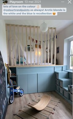 a baby's room with blue walls and wooden flooring is featured on instagram