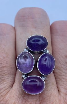 Large genuine amethyst Vintage ring Low content silver not sterling. Size 7  Can be resized by my jeweler for $20 All rings are shipped free in the US in a nice gift box.   Check out our over a THOUSAND great reviews Engraving is $4 per letter and is not always perfect depending on the piece. It can take a few days if the jeweler is busy. This is payable to Paypal Judithsltd@gmail.com Purple Rings With Stones For Gift, Purple Rings With Stones As Gift, Gift Purple Rings With Stones, Amethyst Ring With Stones For Anniversary, Fine Jewelry Amethyst Ring Gift, Amethyst Cabochon Jewelry For Anniversary, Amethyst Ring With Natural Stones For Anniversary, Oval Amethyst Ring With Natural Stones, Oval Purple Amethyst Ring With Natural Stones