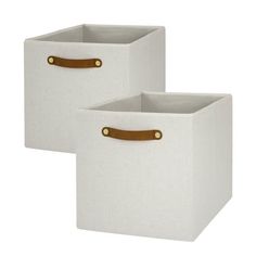 two white storage bins with brown handles